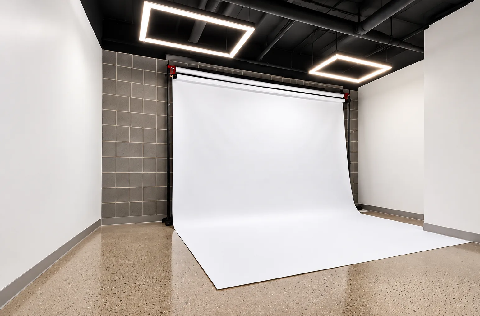 Seamless white paper backdrop under square studio lights